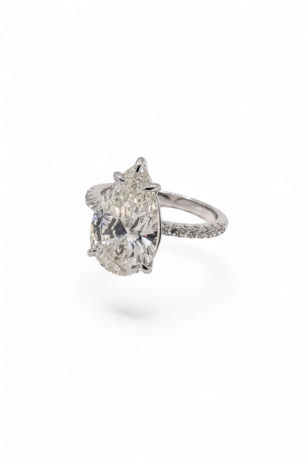 The Solitaire Muse — Pear-Cut Diamond Engagement Ring with Pavé Band