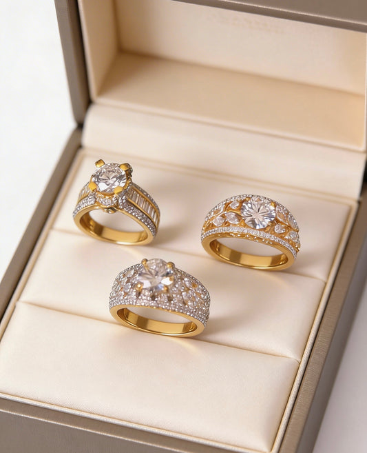 A breathtaking bundle of three yellow gold diamond rings