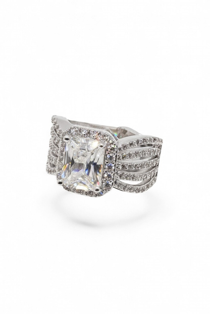 The Wingspan Halo — Emerald-Cut Diamond Ring with Sculptural Multi-Row Shoulders