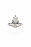 The Solitaire Muse — Pear-Cut Diamond Engagement Ring with Pavé Band