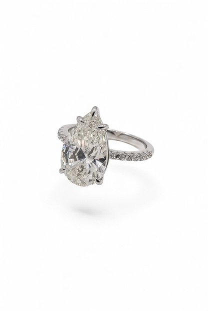 The Solitaire Muse — Pear-Cut Diamond Engagement Ring with Pavé Band
